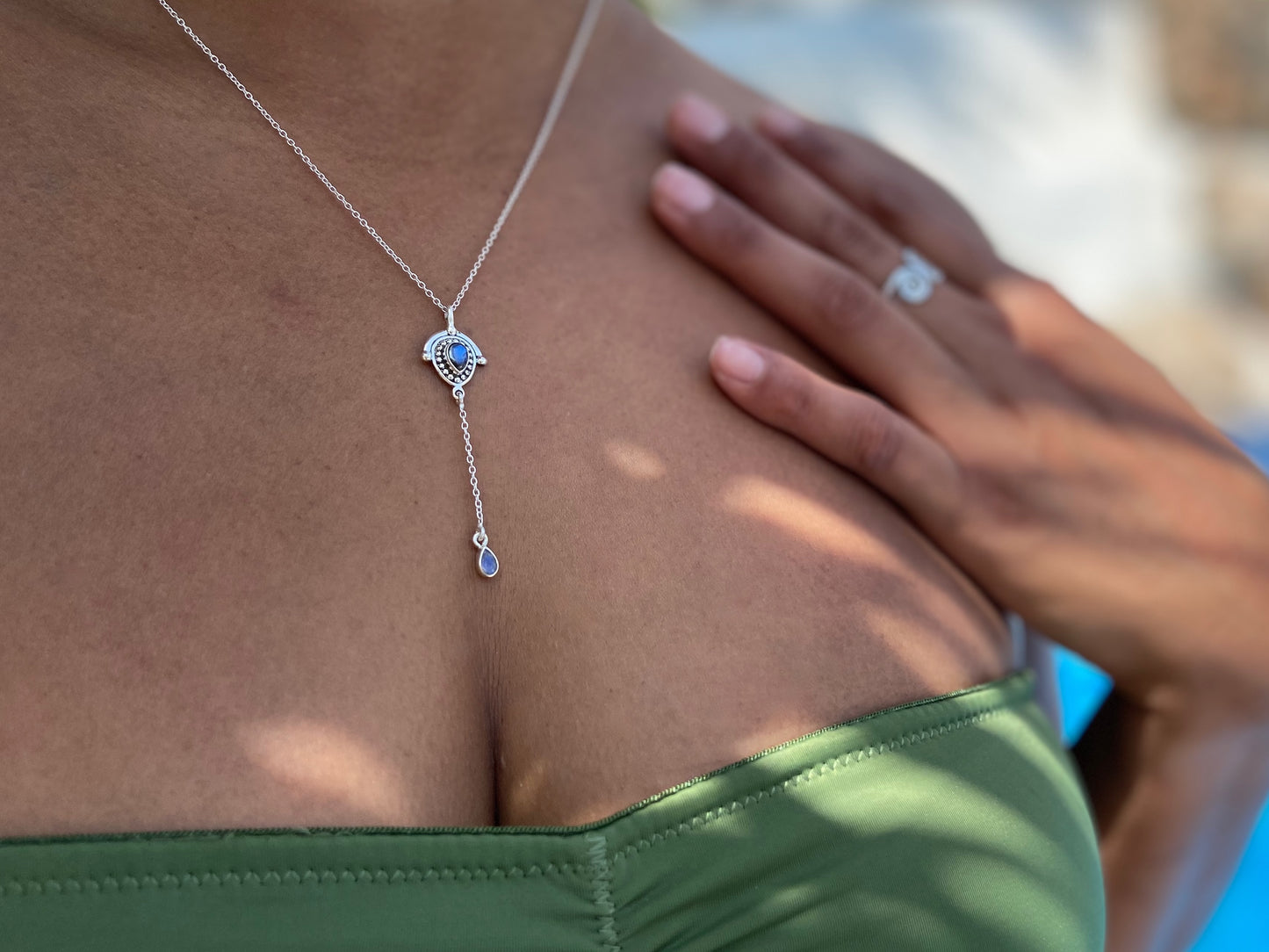 delicate silver necklace with teardrop-shaped labradorite stones