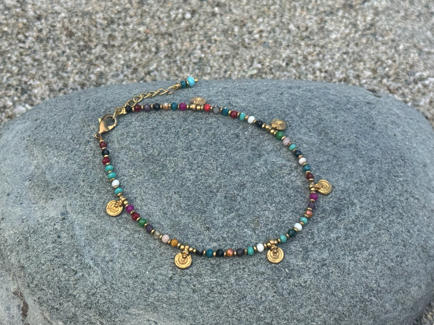 colorful anklet with small spirals made of brass