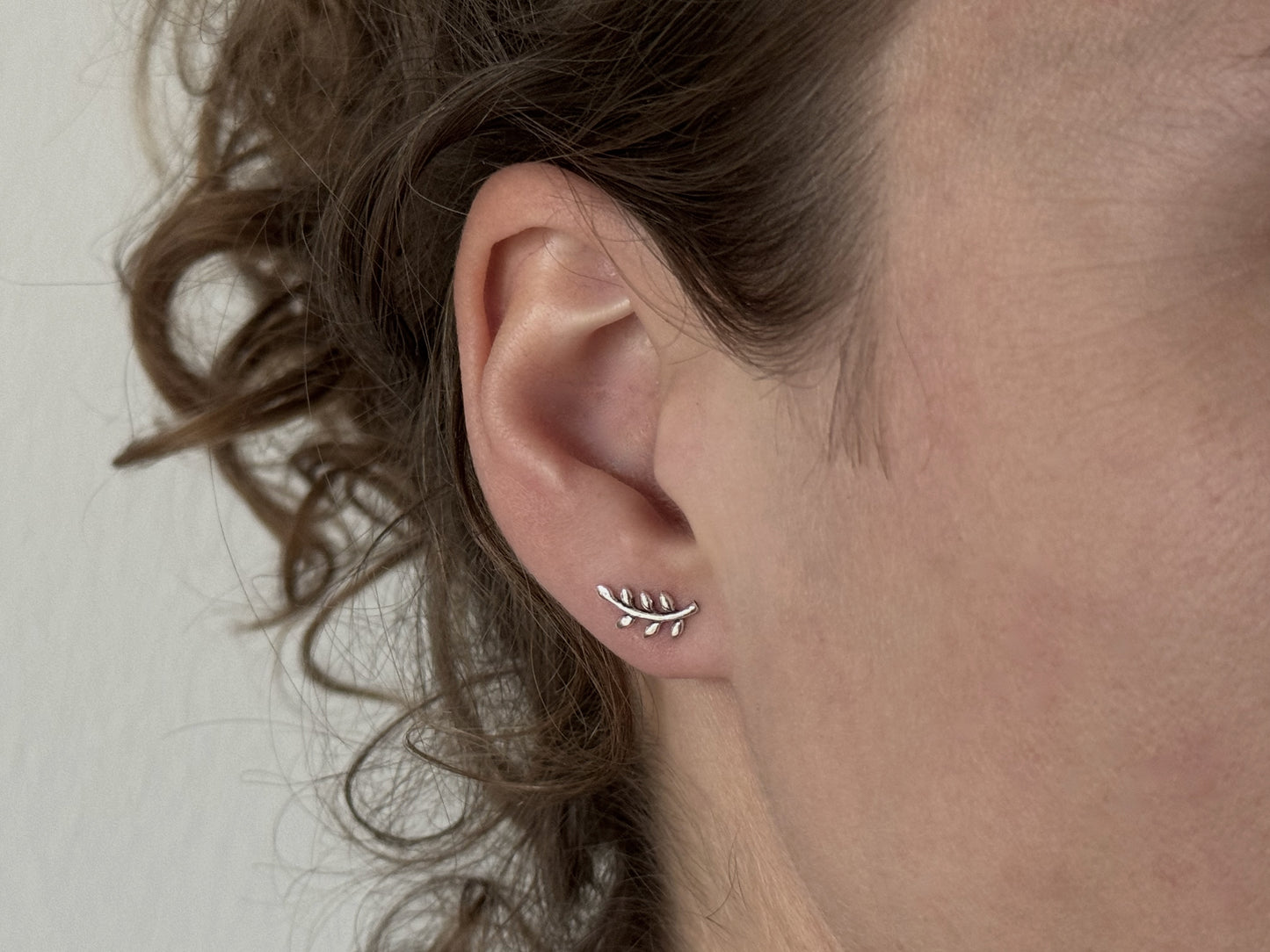 small angel wing stud earrings made of silver