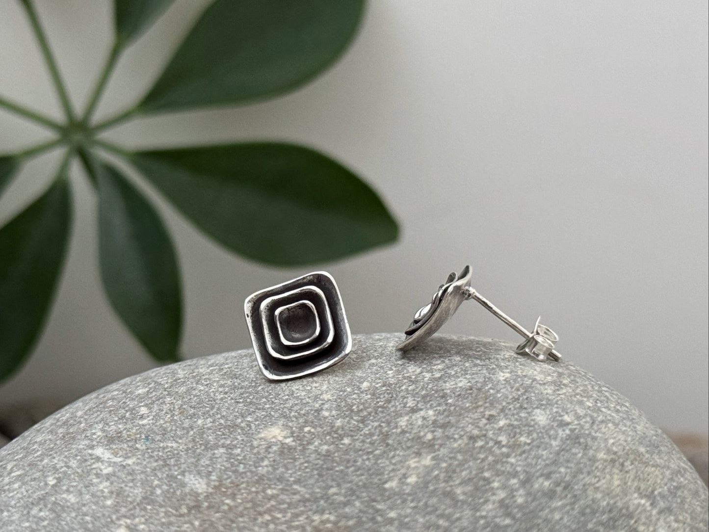 Silver half lotus flower stud earrings