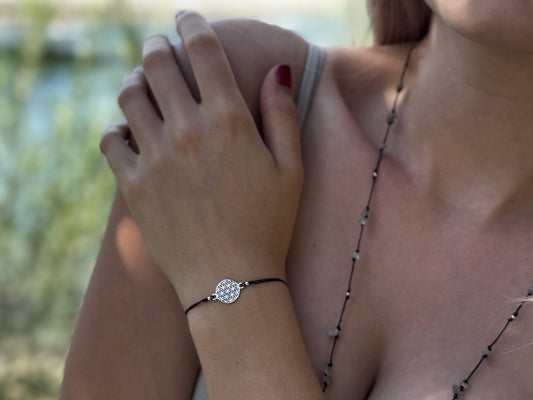 Bracelet made of silver beads with small flowers