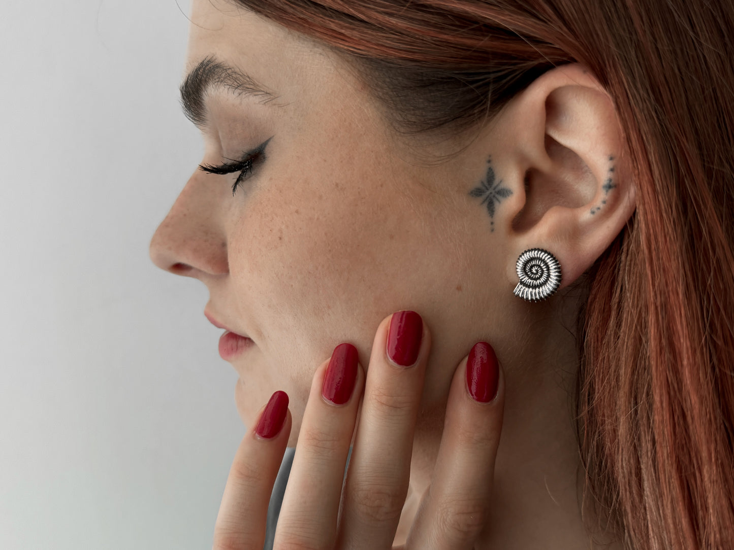 Silver half lotus flower stud earrings