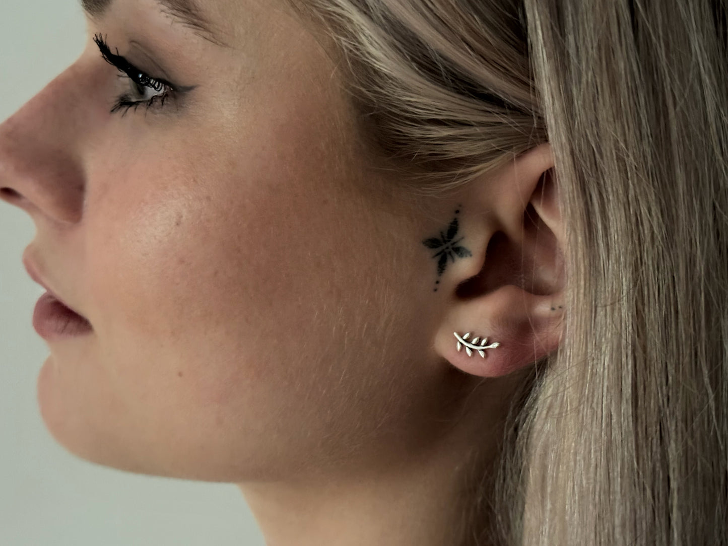 small angel wing stud earrings made of silver
