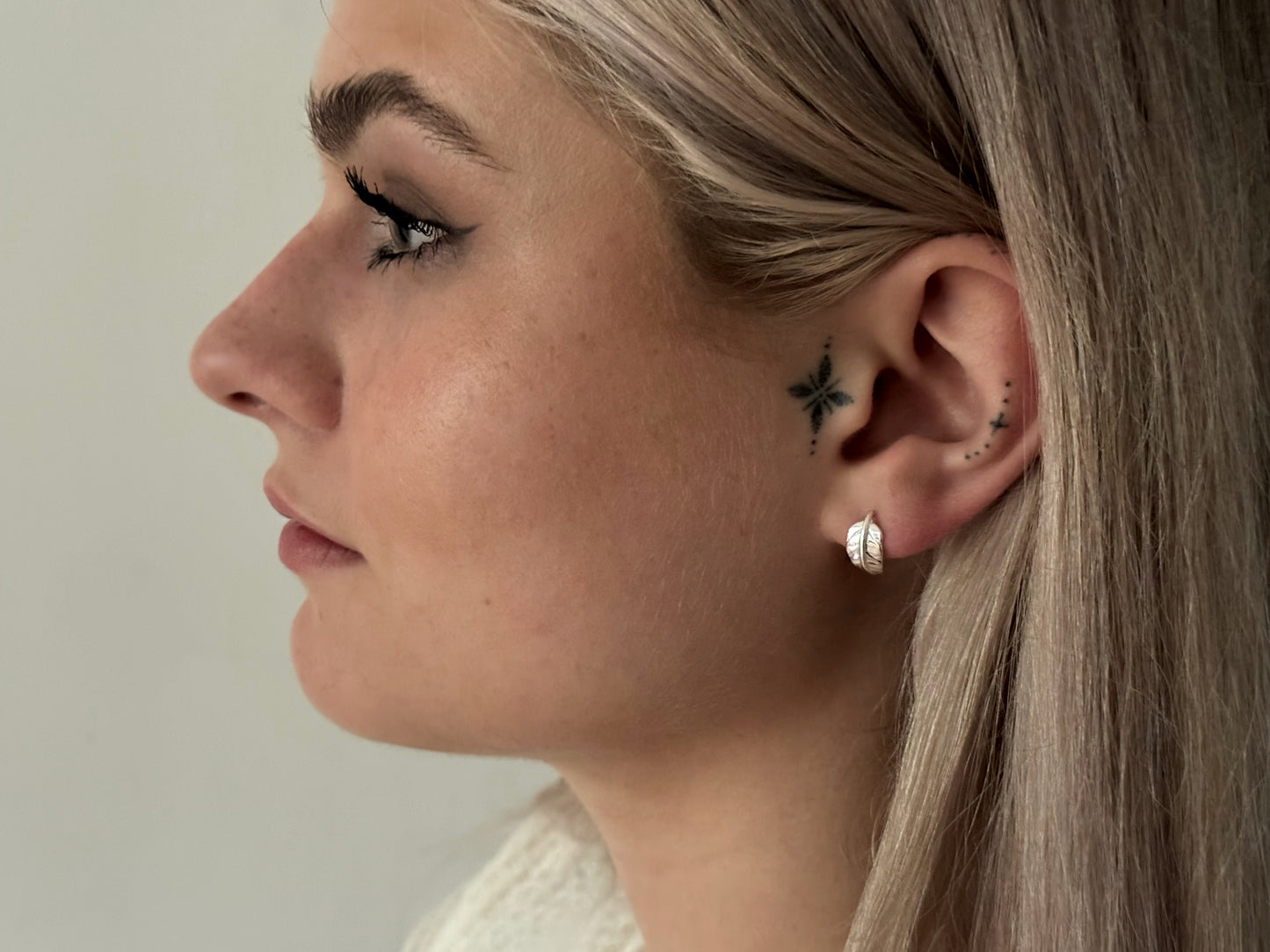 small angel wing stud earrings made of silver
