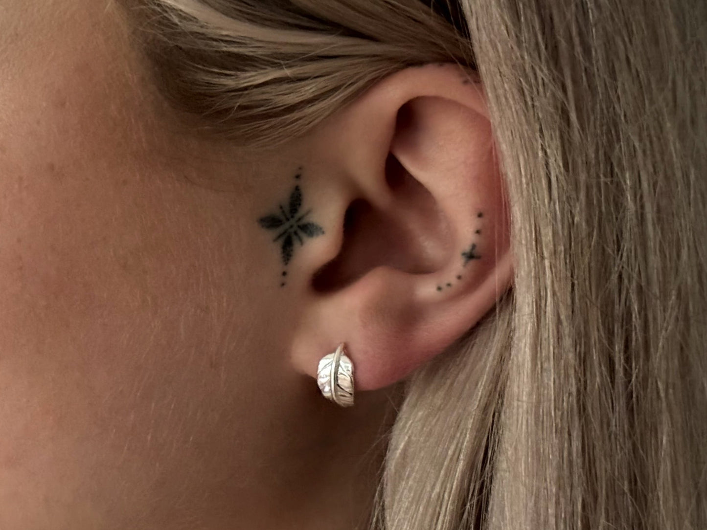 small angel wing stud earrings made of silver