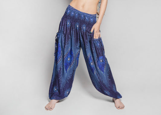 Airy harem pants with a peacock pattern in dark blue