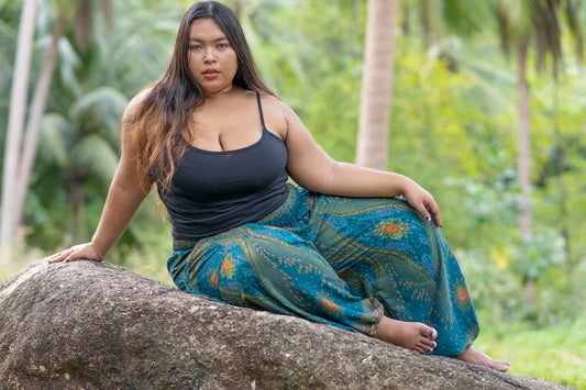 PLUS SIZE airy harem pants with a peacock pattern in turquoise
