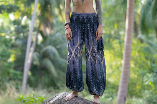 Airy harem pants with a peacock pattern in black