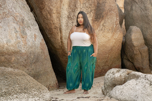 PLUS SIZE airy harem pants with a peacock pattern in turquoise