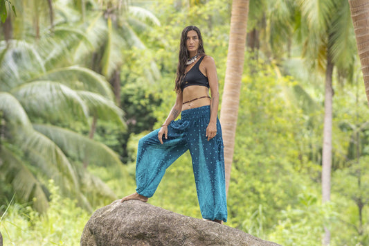 Airy harem pants with a peacock pattern in turquoise with pockets