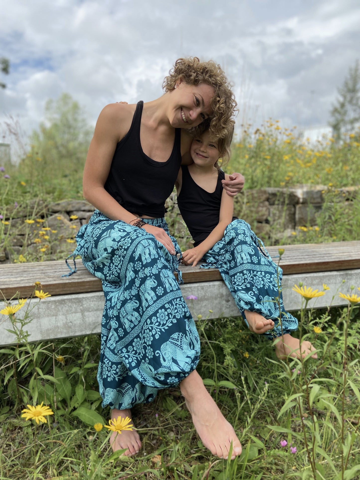 Airy harem pants with an elephant pattern in turquoise with pockets
