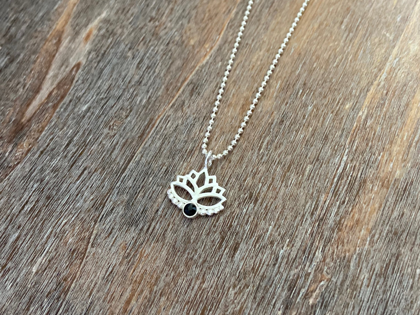 Lotus flower pendant with black onyx stone and silver dots