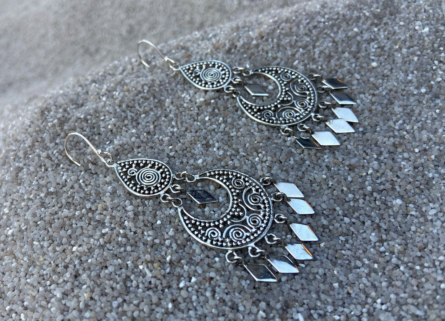filigree earrings with dangling diamonds made of silver