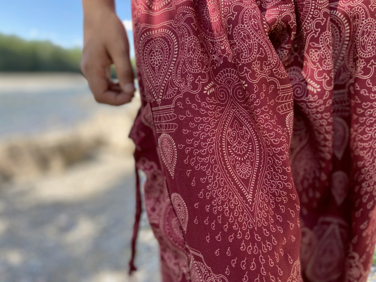 Harem pants with a filigree pattern in red for children