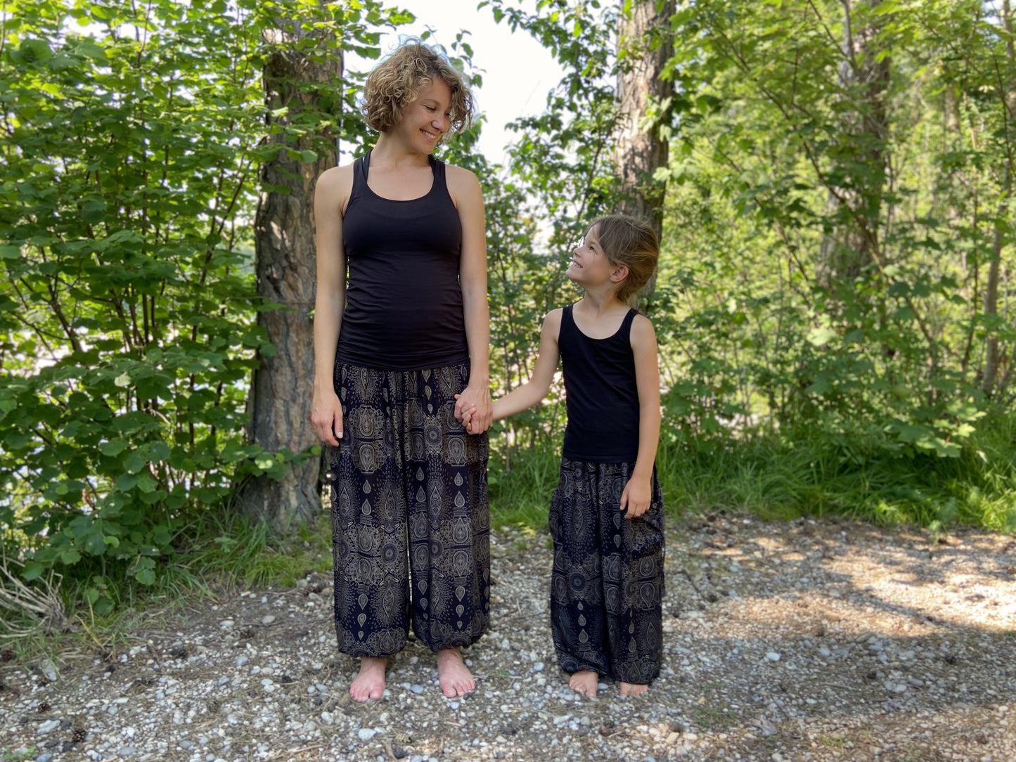 Airy black harem pants with a delicate pattern for children