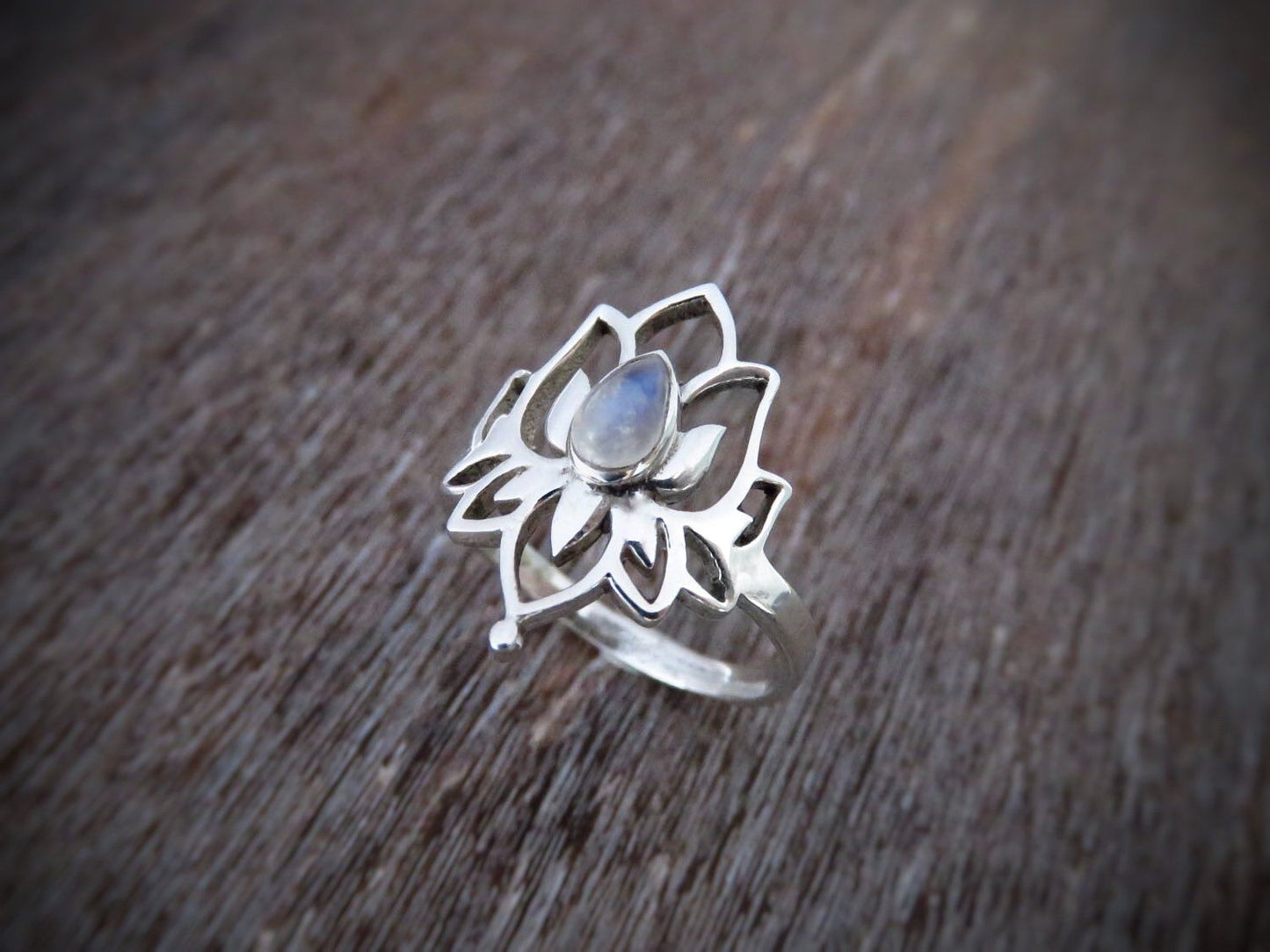 Ring with lotus flower and small stone made of silver