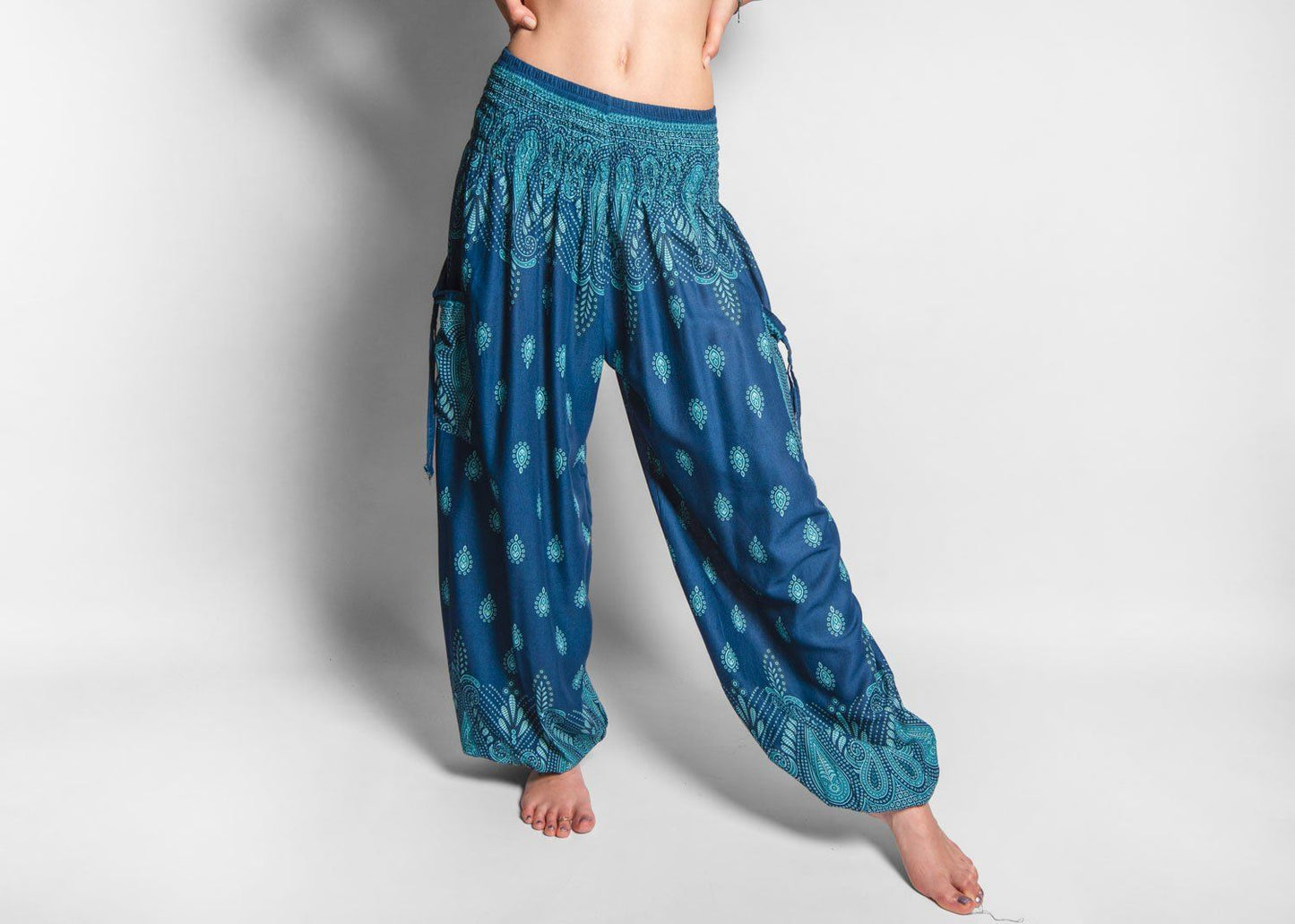 luftige gemusterte Pluderhose in türkis mit Taschen