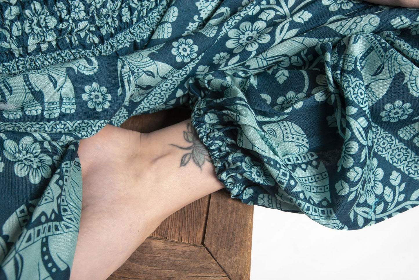 Airy harem pants with an elephant pattern in turquoise with pockets