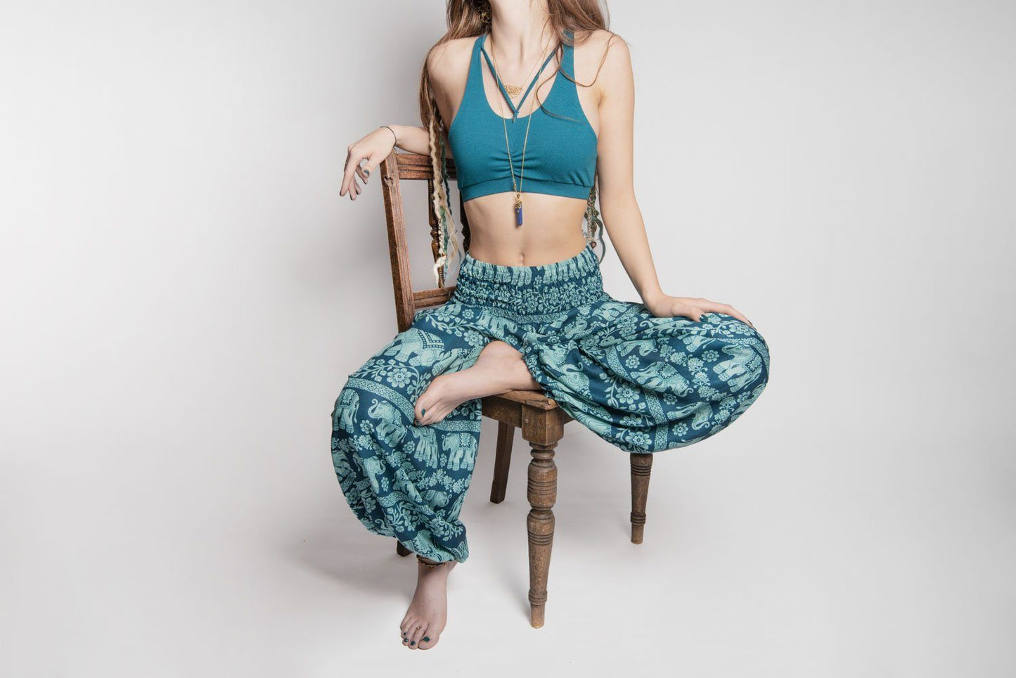 Airy harem pants with an elephant pattern in turquoise with pockets