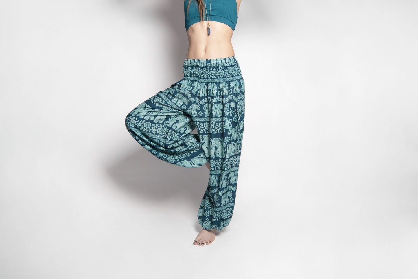Airy harem pants with an elephant pattern in turquoise with pockets