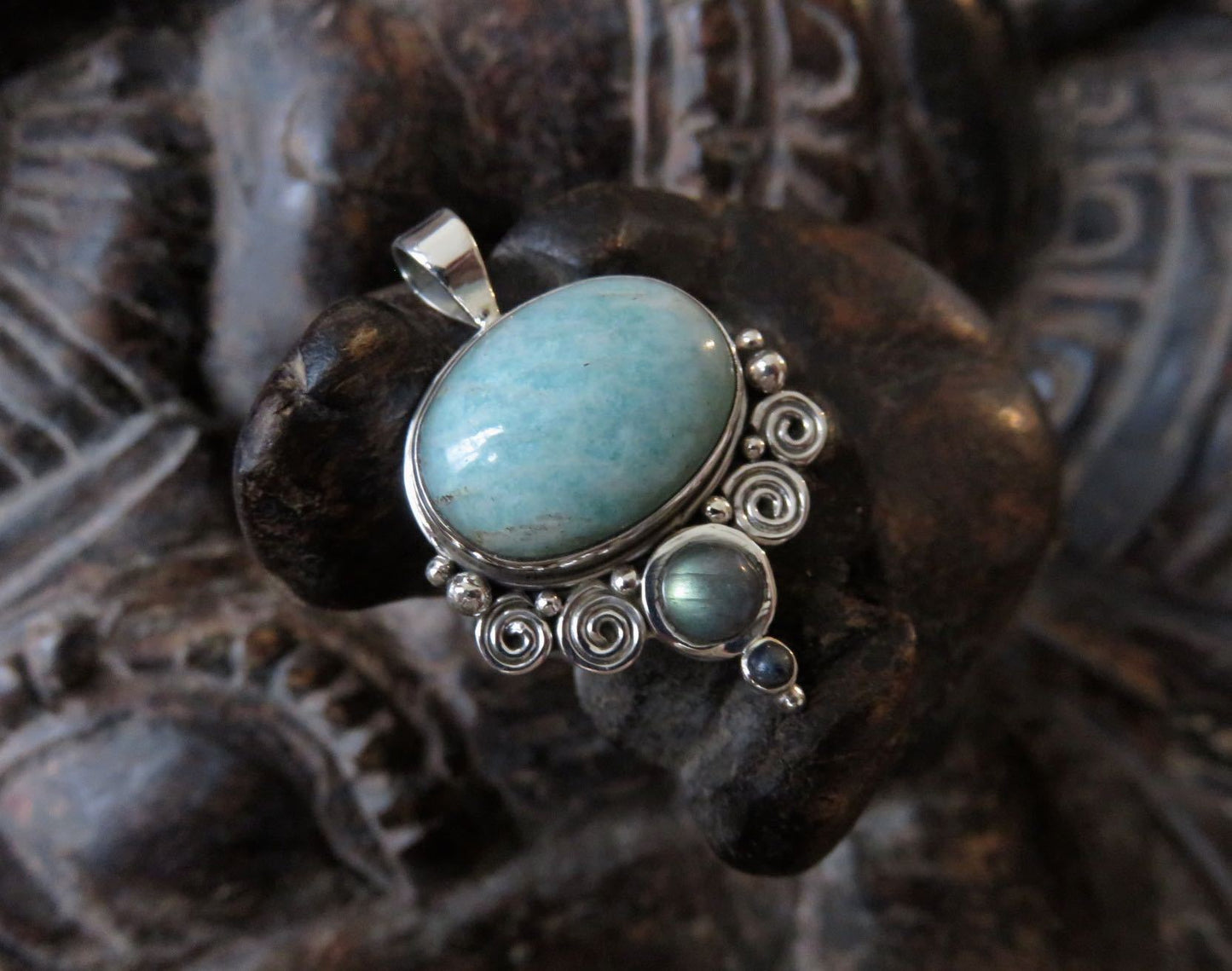 Pendant with spirals and stones made of silver
