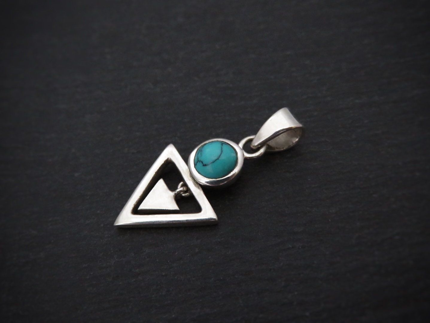 Pendant with stone and small dangling triangle