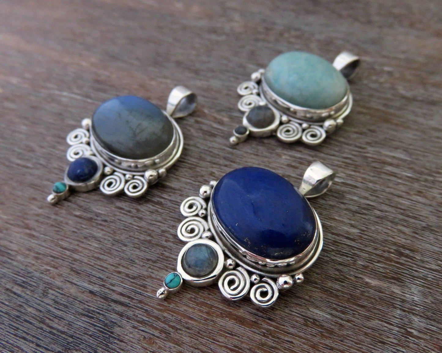 Pendant with spirals and stones made of silver