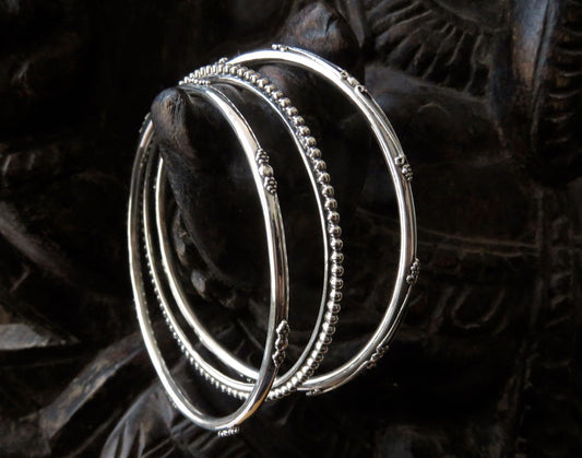 Set of three decorated silver bangles
