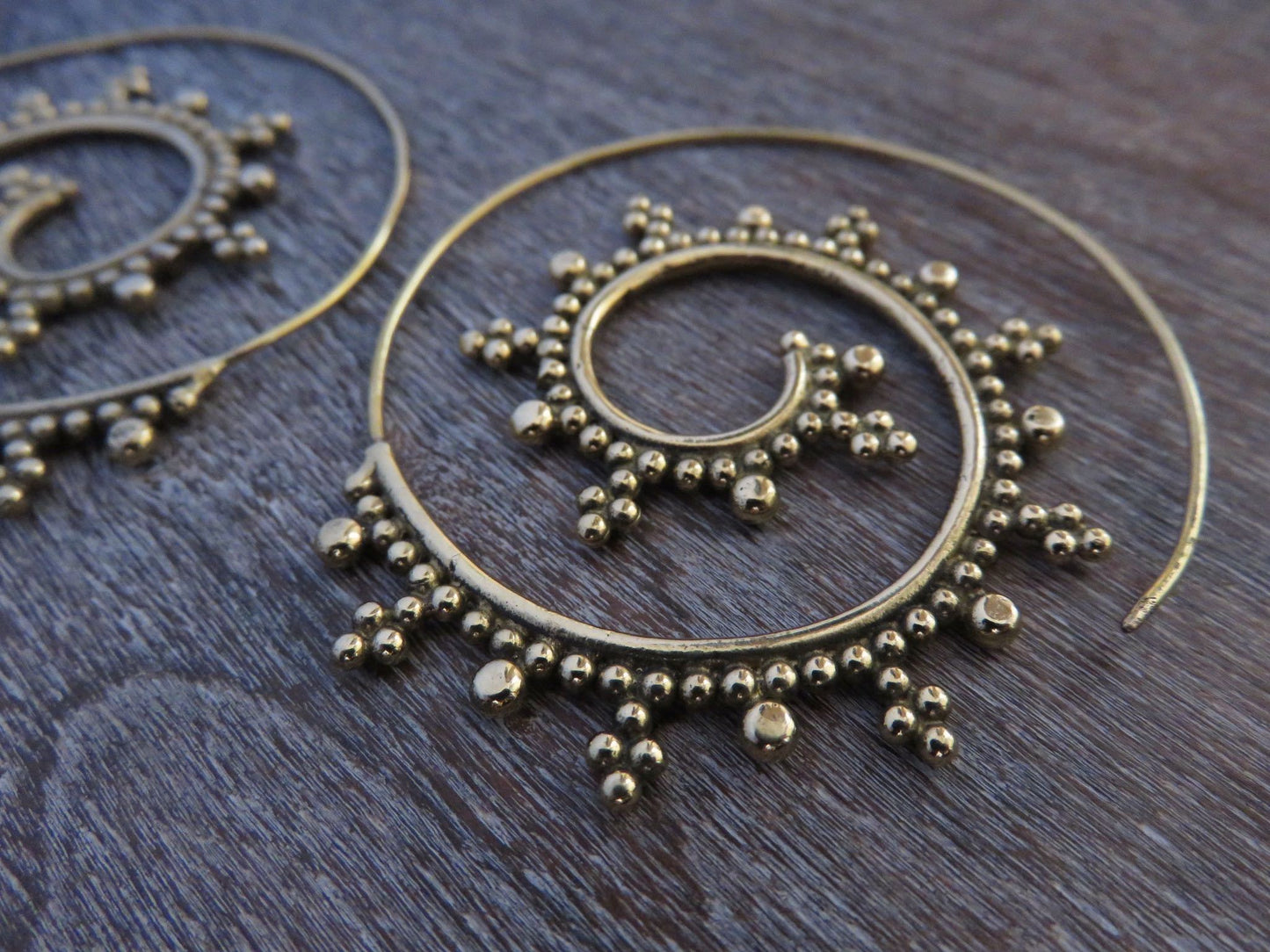 large spiral earrings with brass dots
