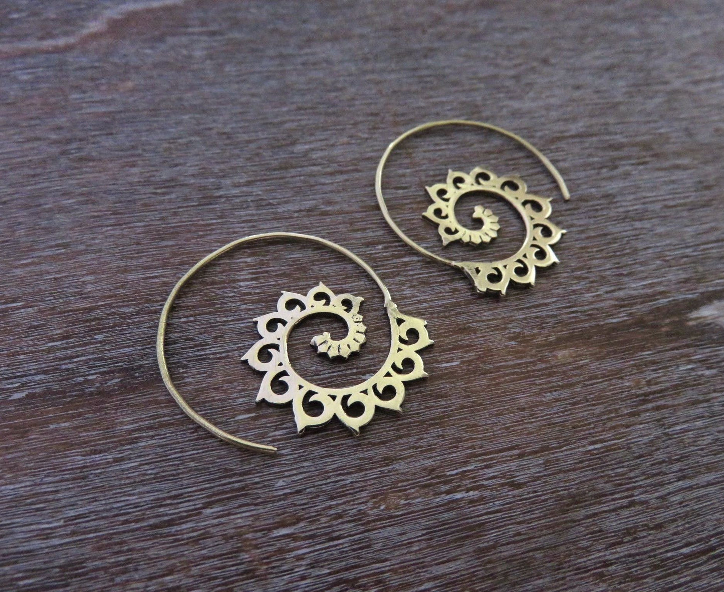 small patterned spiral earrings made of brass