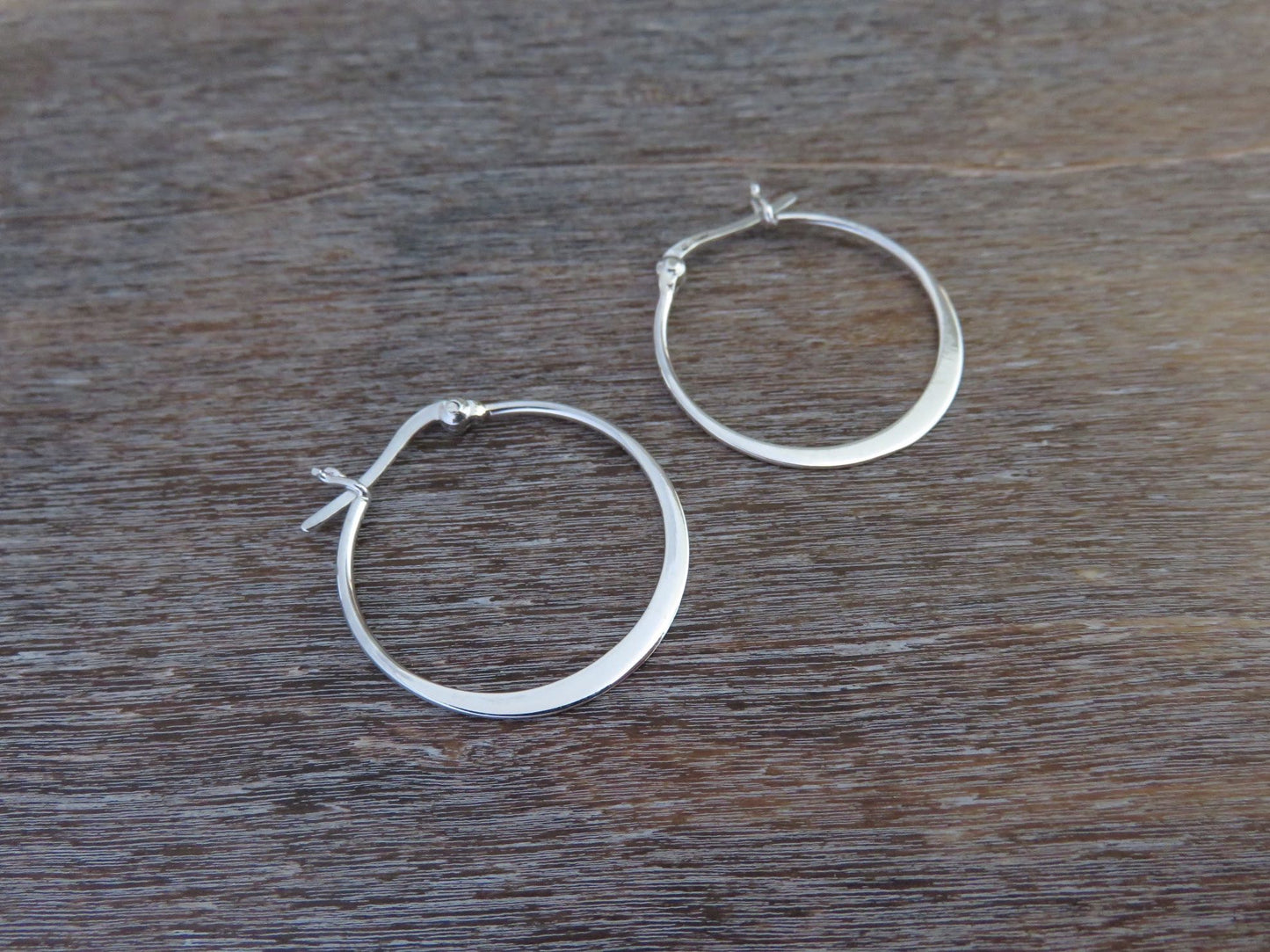 large simple hoop earrings made of silver