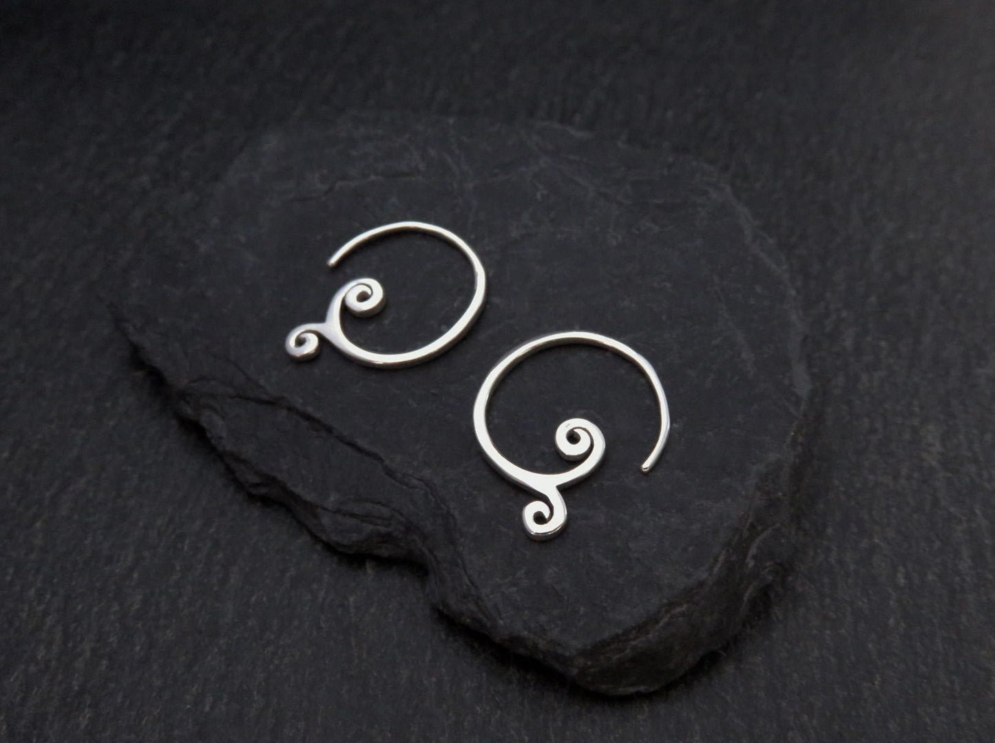 simple small earrings with spirals made of silver