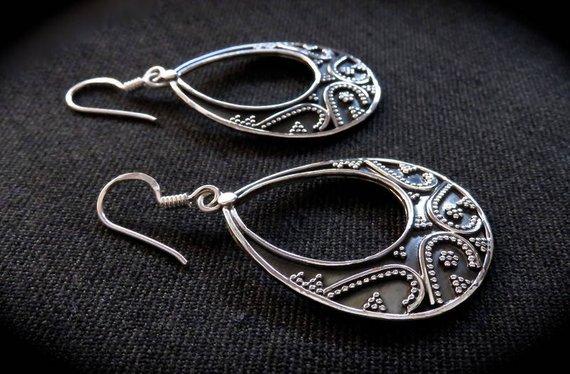 large granulated teardrop-shaped earrings made of silver
