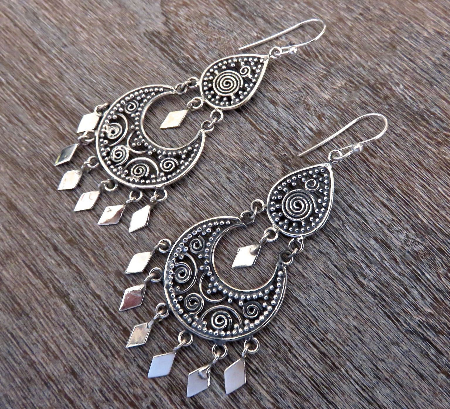 filigree earrings with dangling diamonds made of silver