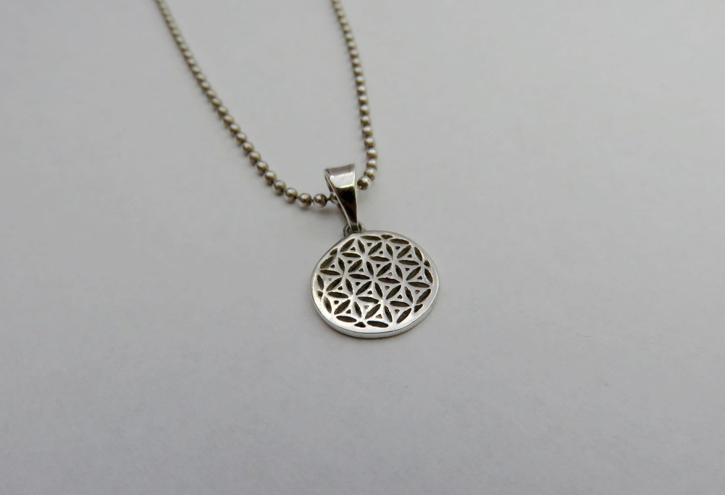 Necklace with the motif of the flower of life made of silver