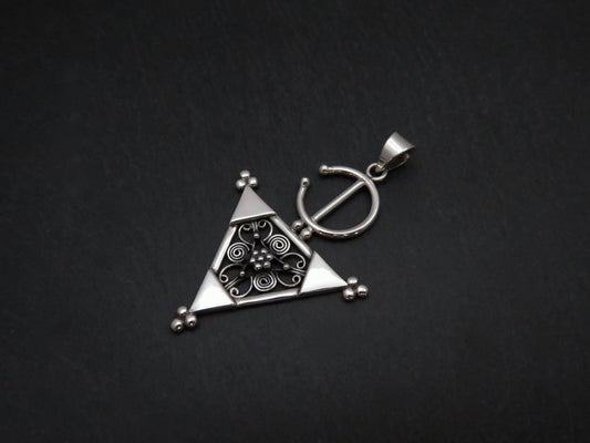 Pendant with a filigree decorated triangle made of silver