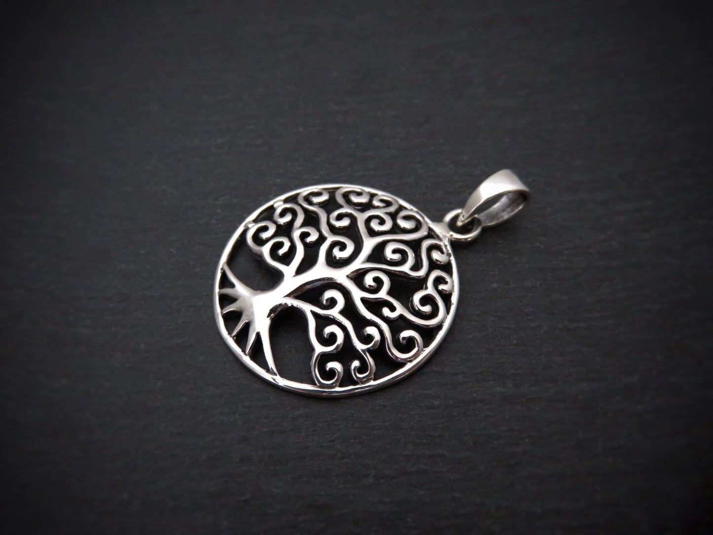 Domed pendant with the motif of the tree of life made of silver