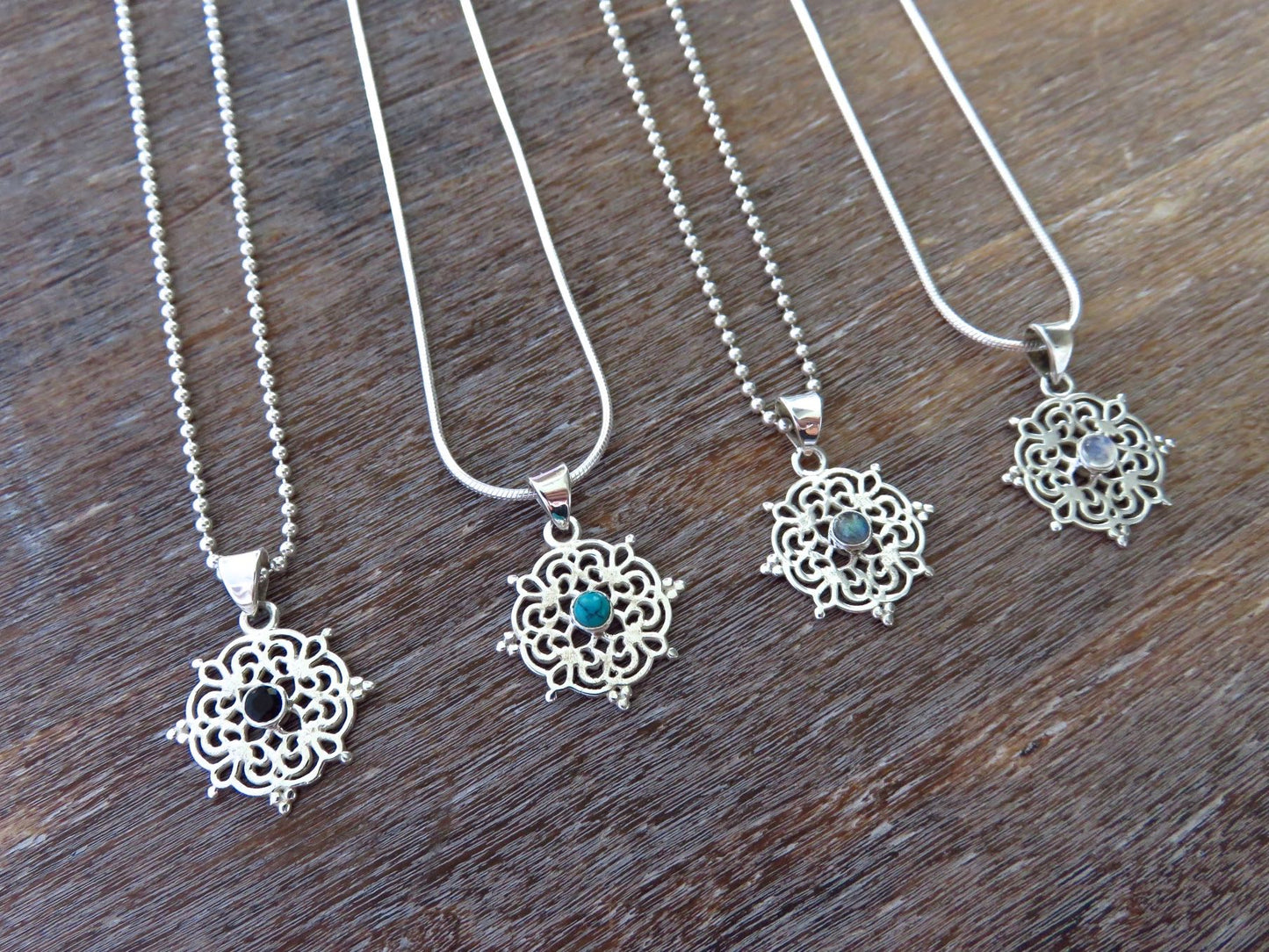small filigree pendant with black spinel made of silver