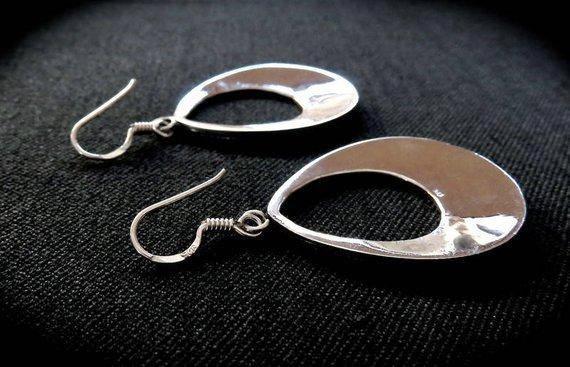 large granulated teardrop-shaped earrings made of silver