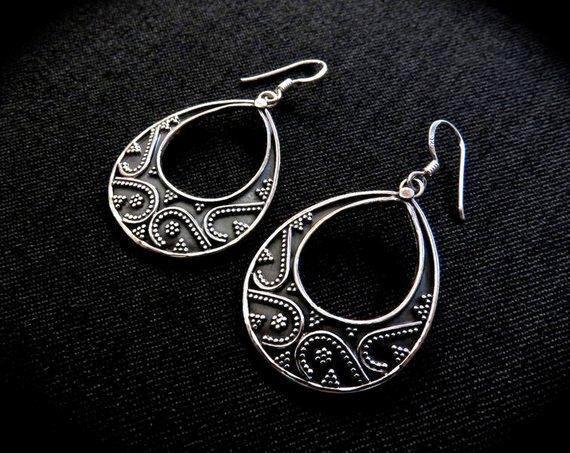 large granulated teardrop-shaped earrings made of silver