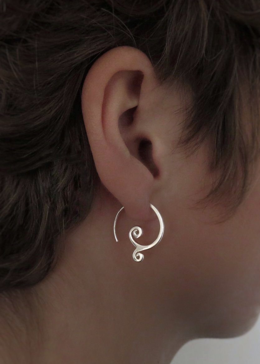 simple small earrings with spirals made of silver