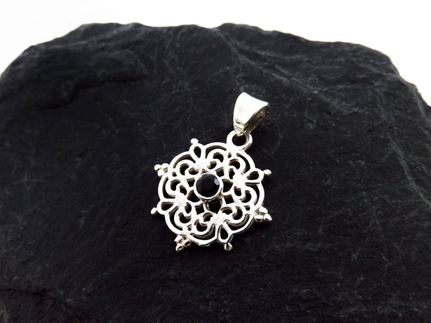 small filigree pendant with black spinel made of silver
