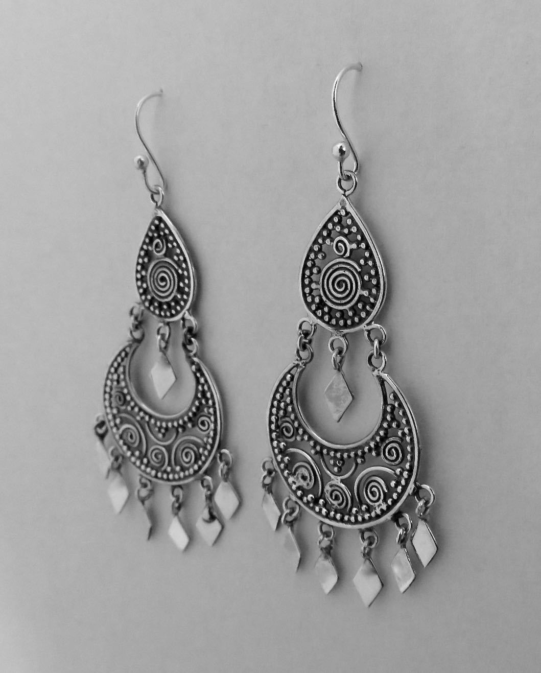 filigree earrings with dangling diamonds made of silver
