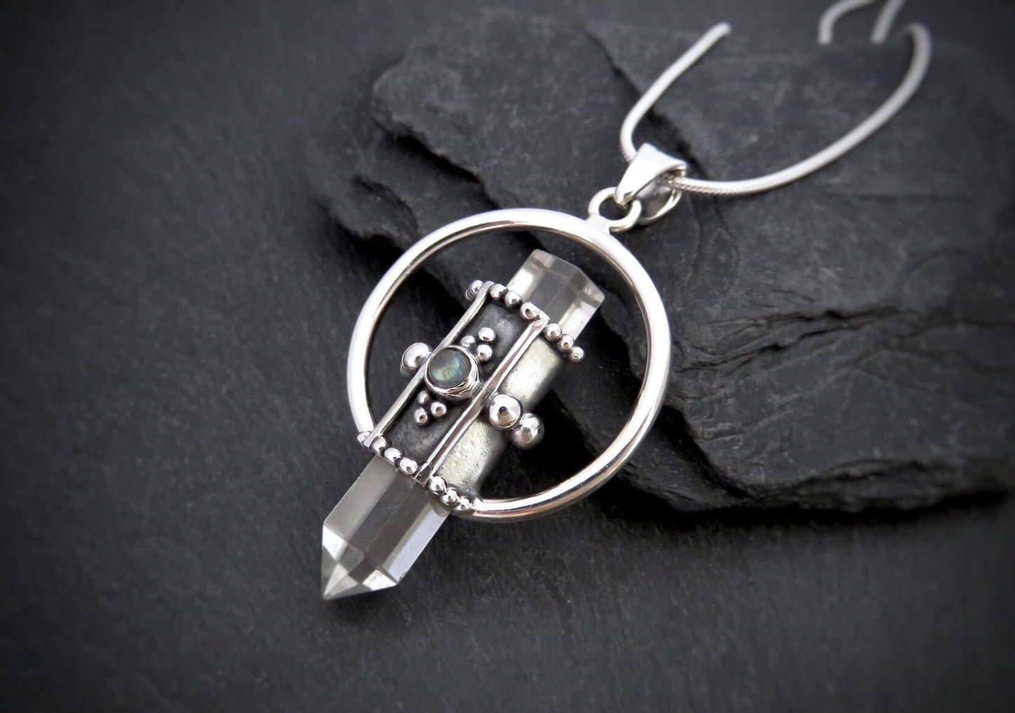 Rock crystal pendant with small stone made of silver