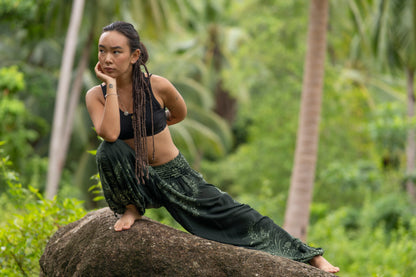 Dark green patterned harem pants with pockets in black