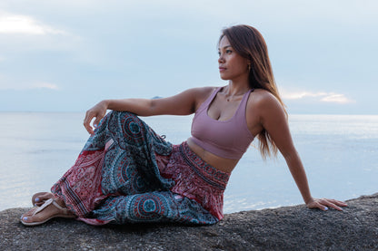 Airy harem pants with a peacock pattern in purple