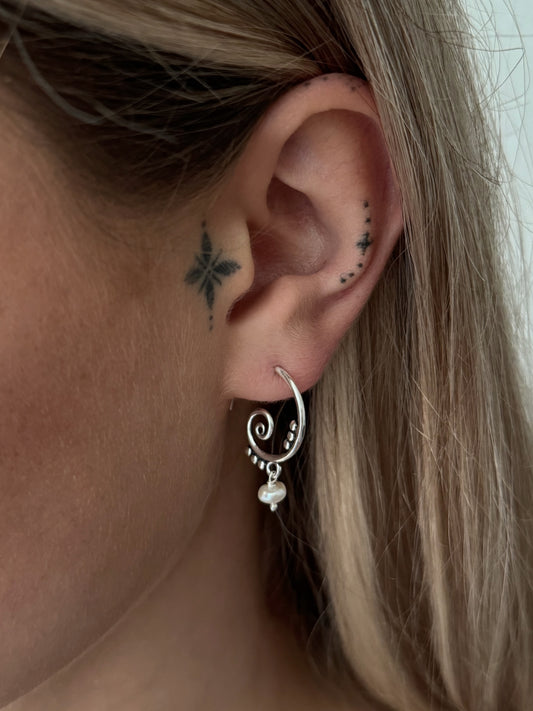 Silver hoop earrings with dangling tourmaline stones 