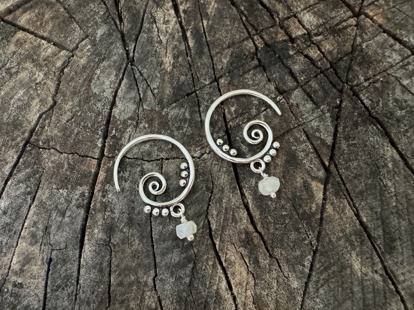 Silver hoop earrings with dangling tourmaline stones 