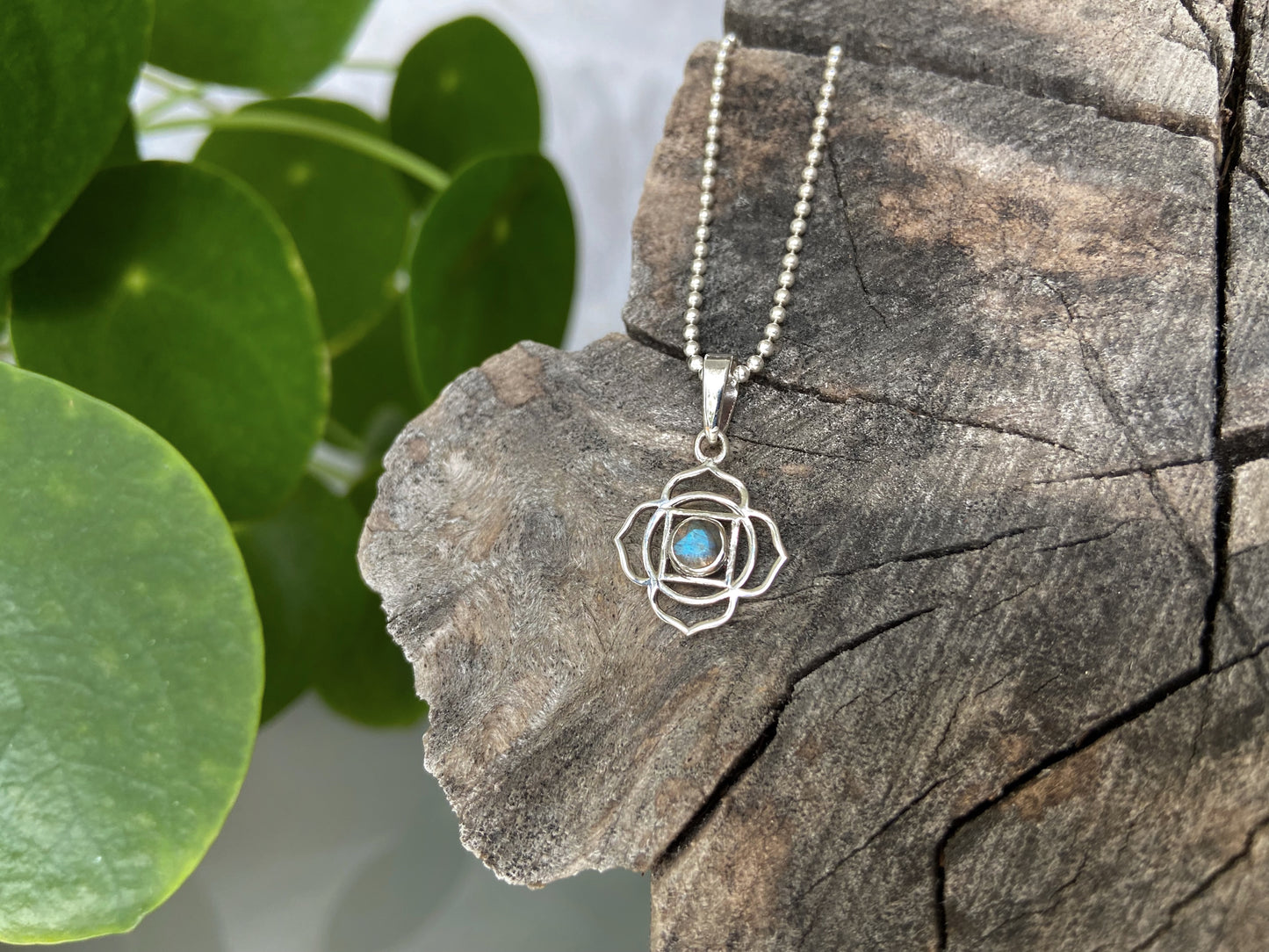 small geometric flower pendant with stone made of silver