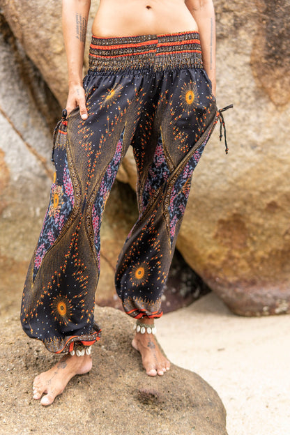 colorfully patterned harem pants with pockets in dark blue